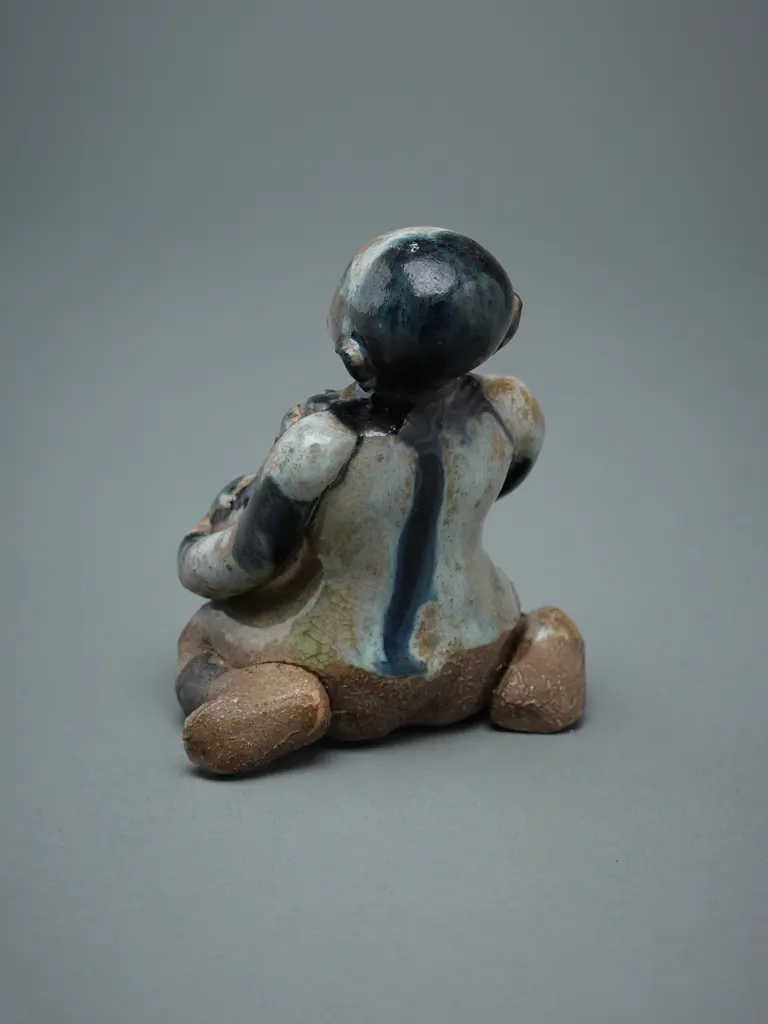 A Sawankhalok stoneware figure (tukatha), Image 1++